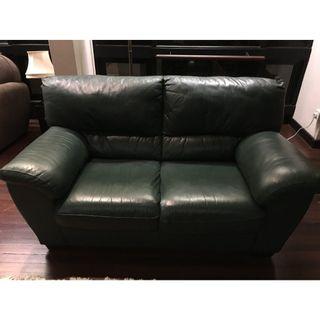 Two seater leather green sofa and pouffe