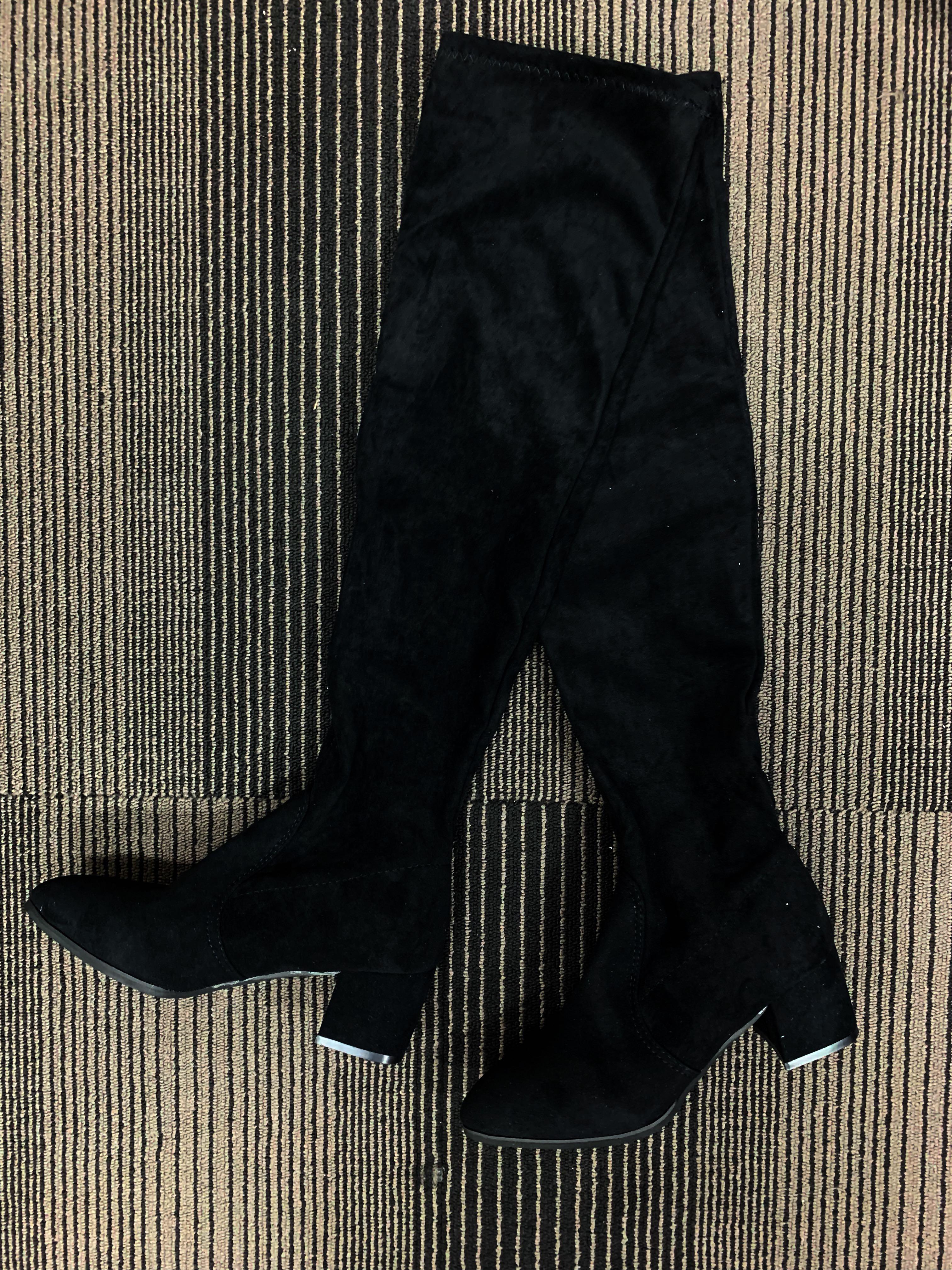Long black over knee boots on heels 