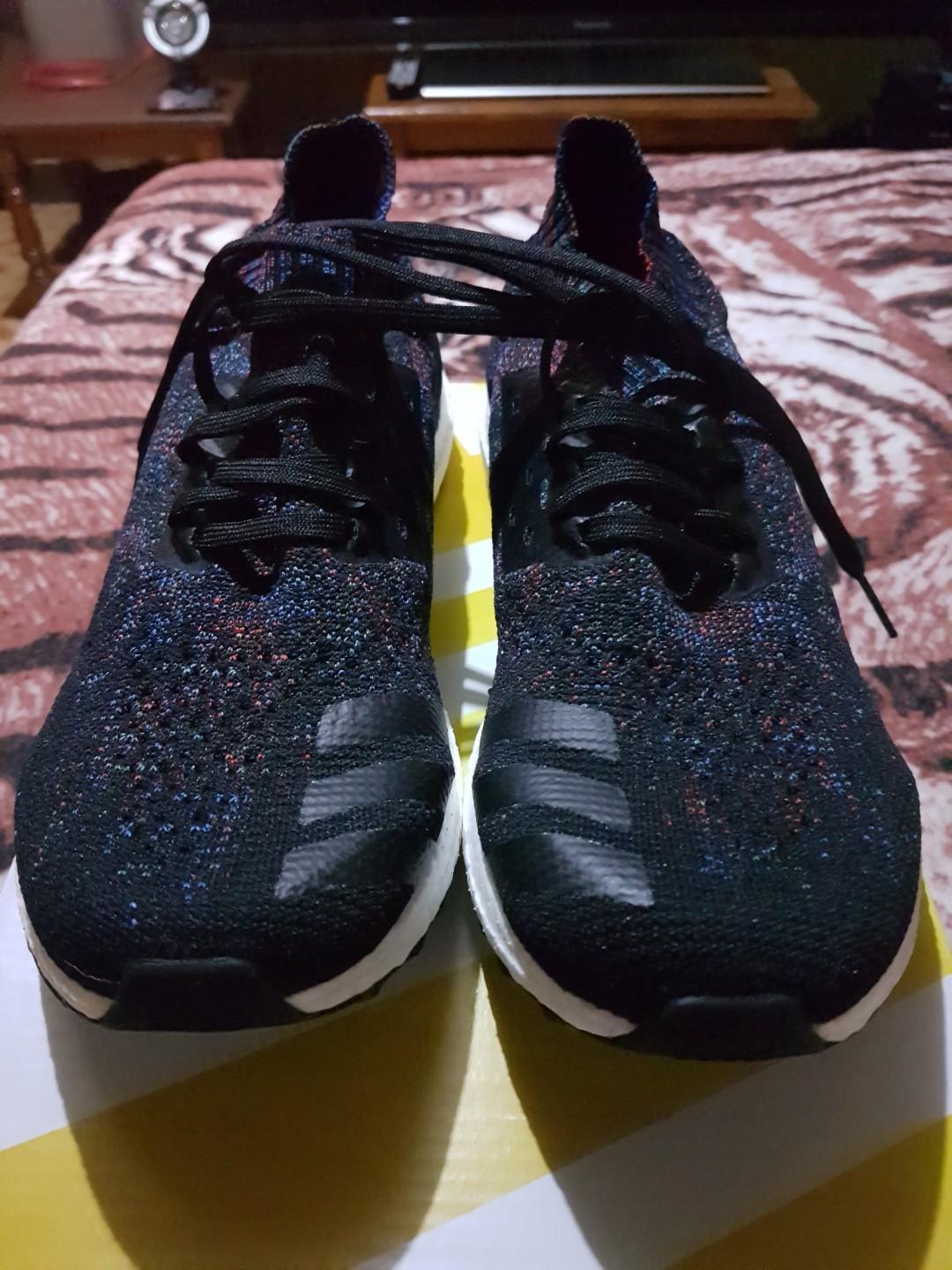 ultra boost uncaged core black active red