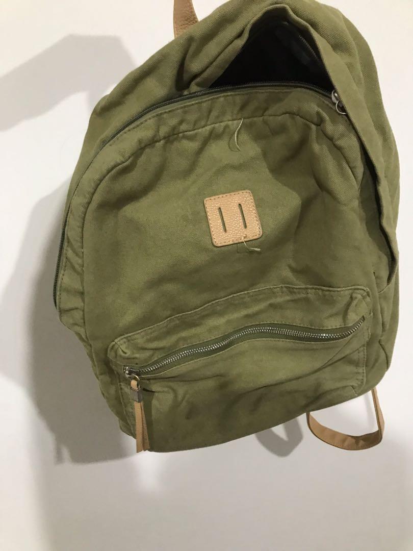 small green backpack