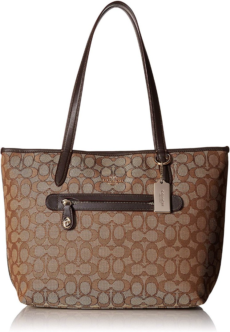 Coach Signature Tote Bag (Category: Luxury Bags & Wallets) located in Manila. Submitted by classymumsy (Listing ID 229395285, Image 1). Description: New with tag. Not original quality. Authentic bought from Coach store. #mayfree.