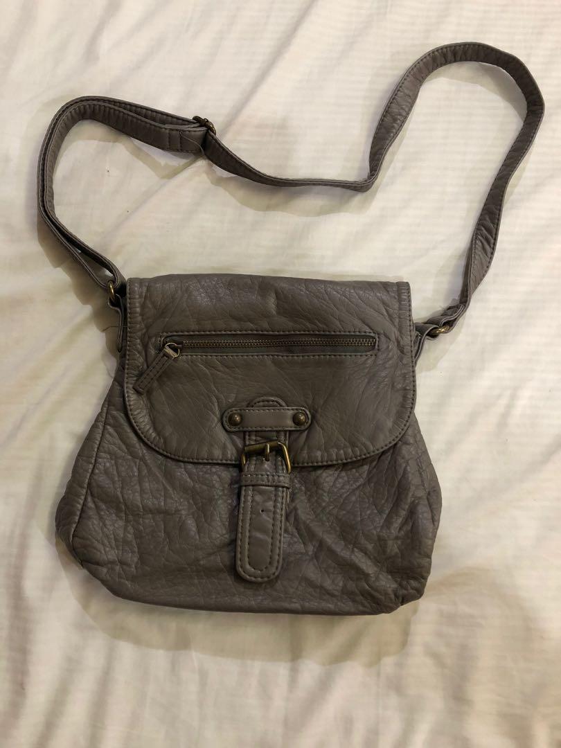 Gray leather bag (Category: Cross-body Bags) located in Pasig City. Submitted by seconds4pas (Listing ID 229348501, Image 3). Description: Decluttering .