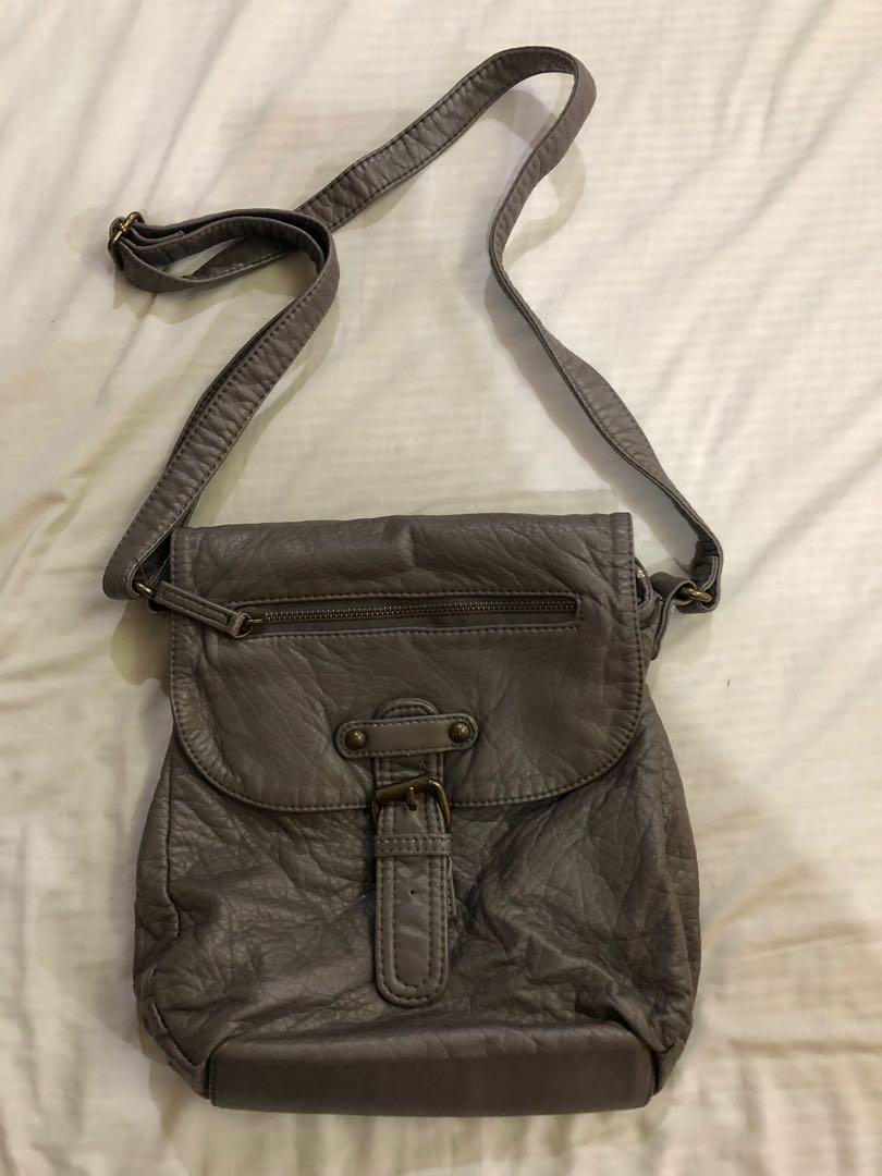 Gray leather bag (Category: Cross-body Bags) located in Pasig City. Submitted by seconds4pas (Listing ID 229348501, Image 1). Description: Decluttering .