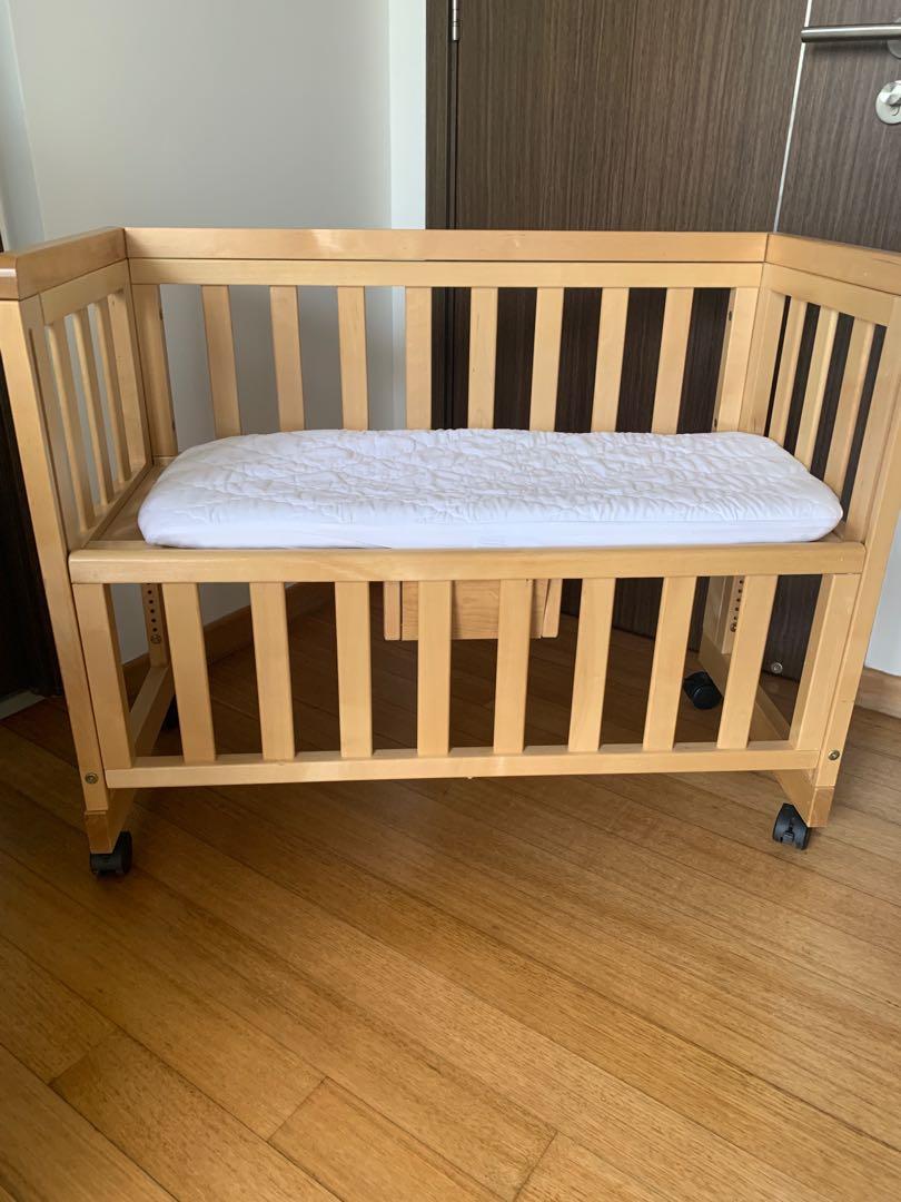 wooden bedside cot