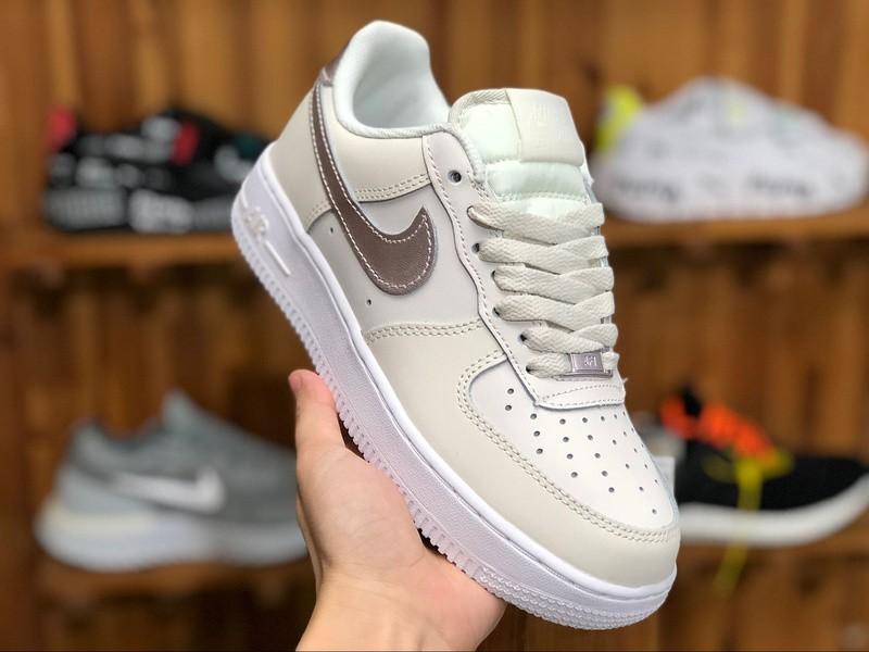 Nike white rose gold top