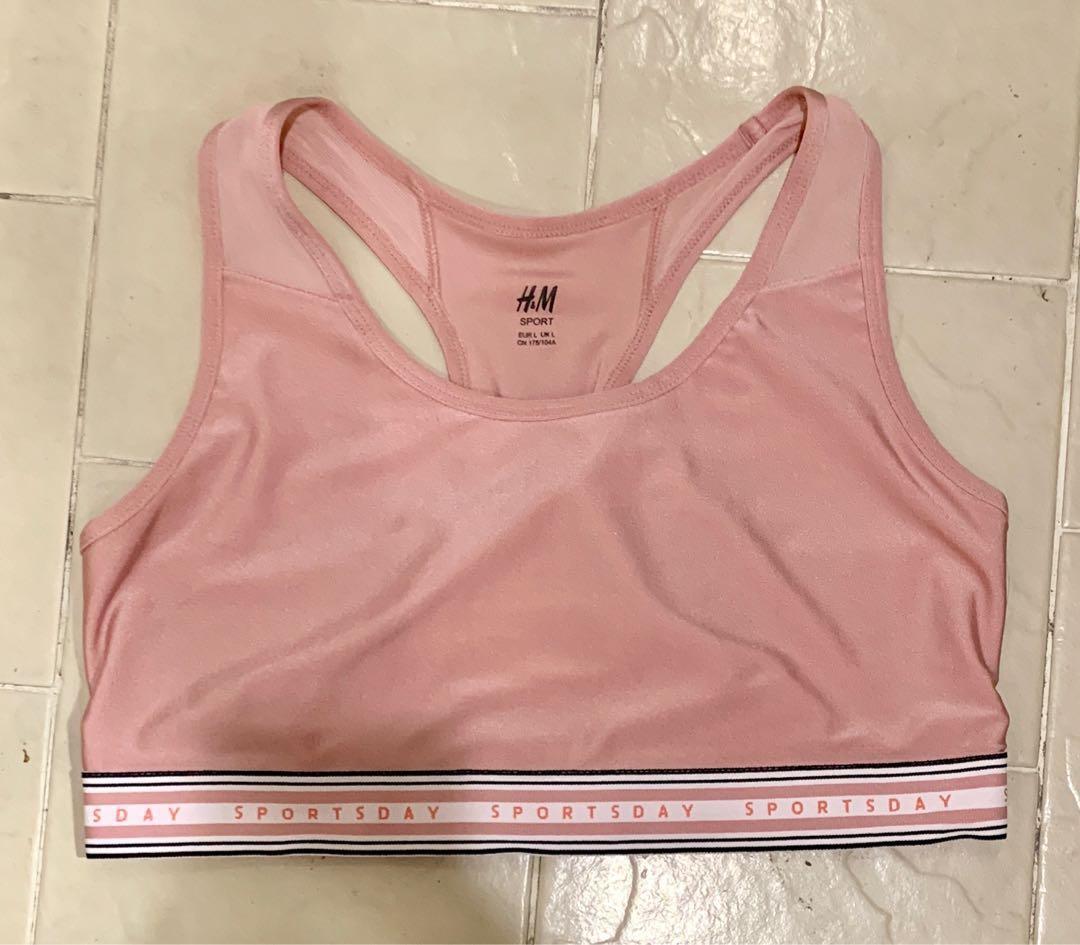H&M Pink sports bra medium support size L (Category: Activewear) located in Quezon City. Submitted by buzzlightyear182 (Listing ID 229585754, Image 2). Description: Used once only too big for me Original price was P799 Size is Large CN 175/104A Quick dry with mesh Sports bra in fast-drying functional fabric with a lined front, racer back with sections in ventilating mesh and a wide elastic hem. Medium support..