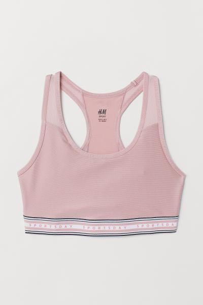 H&M Pink sports bra medium support size L (Category: Activewear) located in Quezon City. Submitted by buzzlightyear182 (Listing ID 229585754, Image 1). Description: Used once only too big for me Original price was P799 Size is Large CN 175/104A Quick dry with mesh Sports bra in fast-drying functional fabric with a lined front, racer back with sections in ventilating mesh and a wide elastic hem. Medium support..