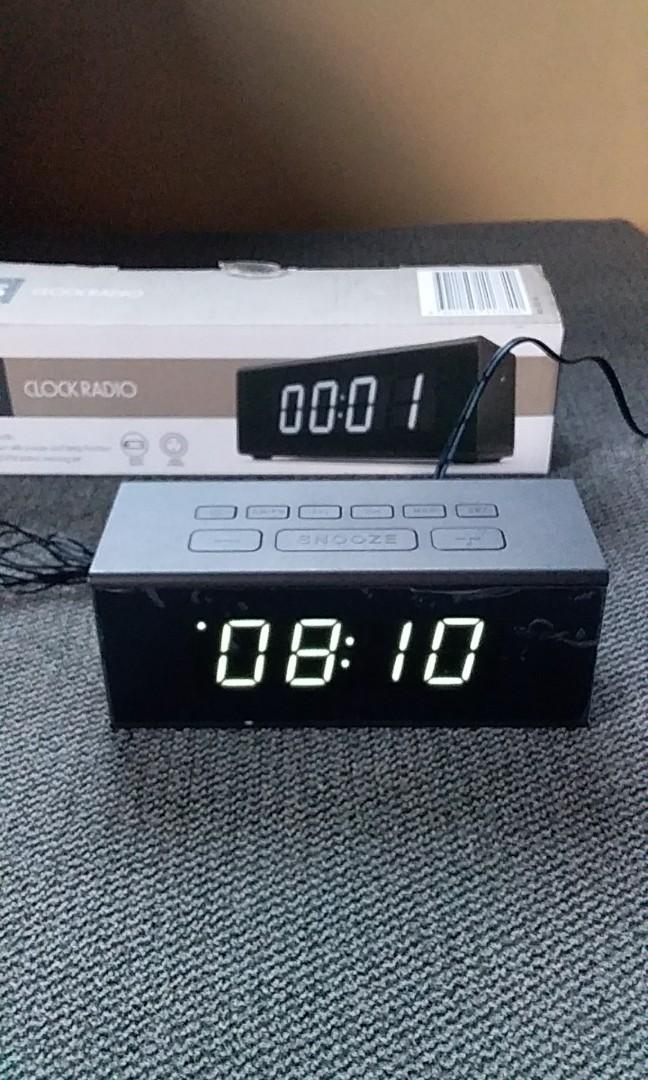 Digital clock and radio (Category: Clocks) located in Manila. Submitted by PickClickShip (Listing ID 230264207, Image 2). Description: Digital Clock and Radio - AM/FM radio - Digital Clock - Dual alarm with snooze and sleep function - can use ac adaptor or batteries - 20AM/FM station memory set - color: Urban black - 220V - uses 2pcs Triple AAA for memory backup - set comes with adaptor and manual.