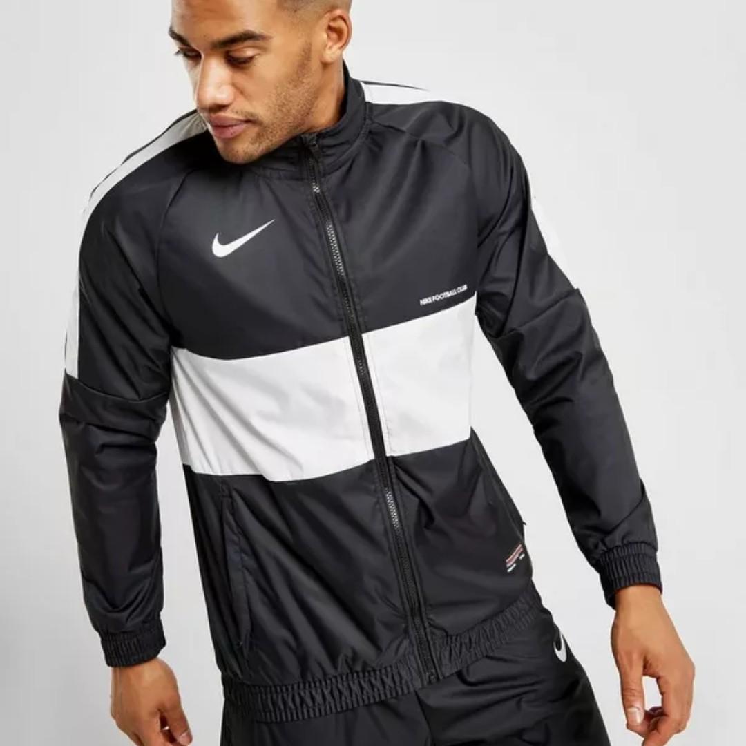 nike woven track top