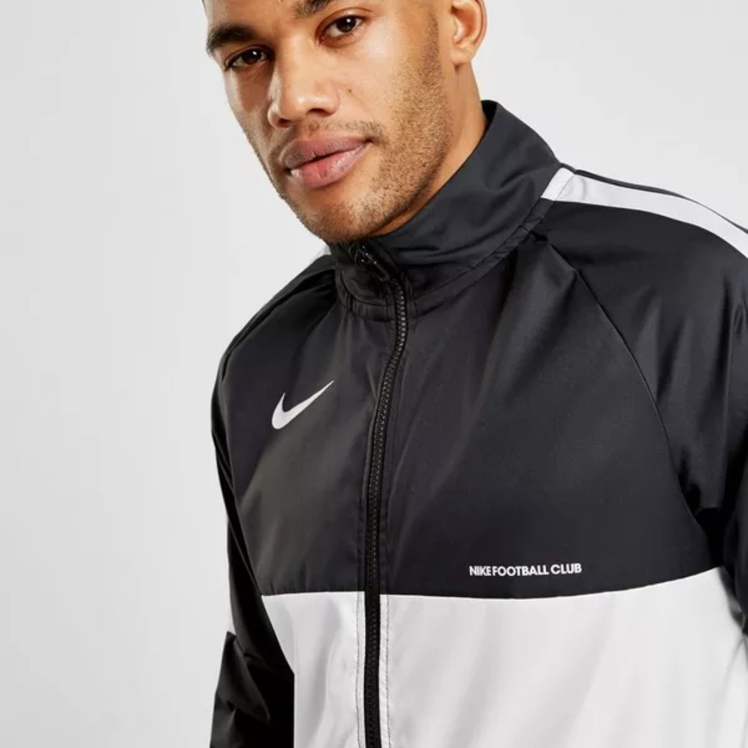 nike woven track top