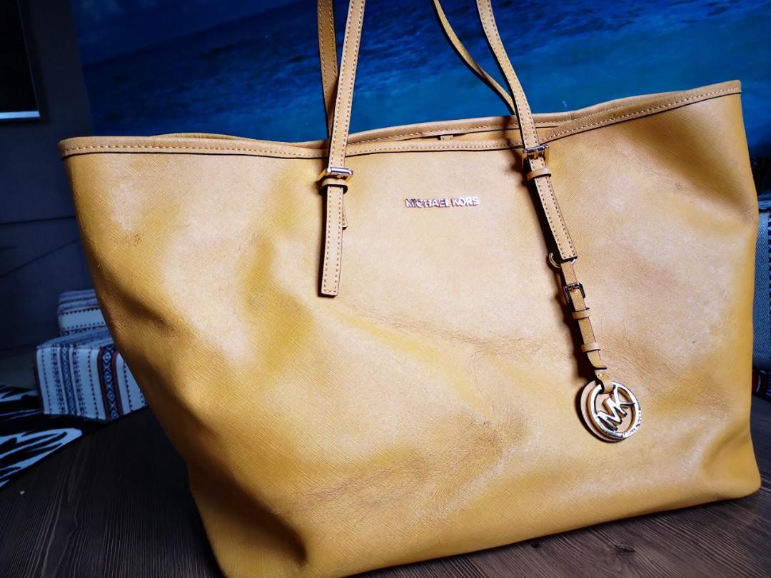 Authentic Mustard Michael Kors handbag leather JET SET TRAVEL, Women's  Fashion, Bags & Wallets, Cross-body Bags on Carousell