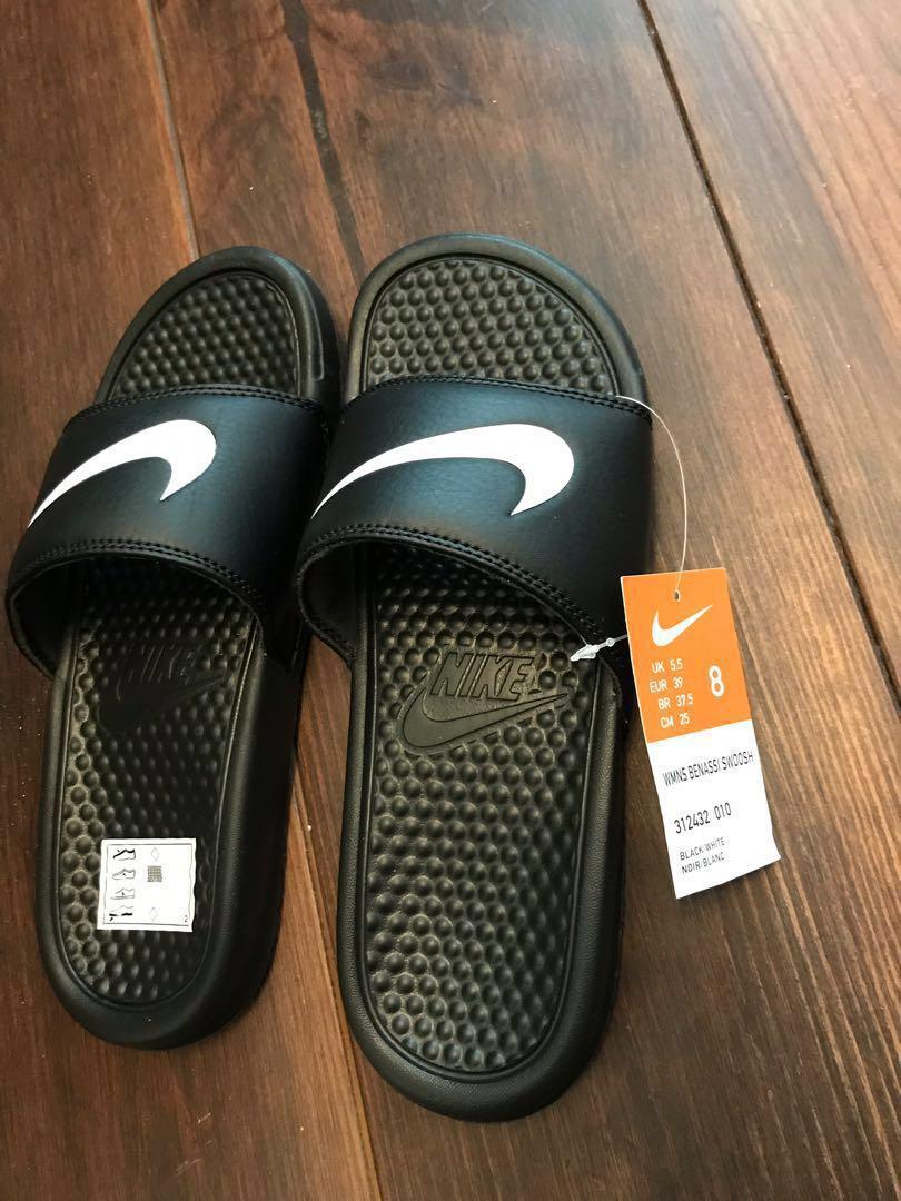 Nike swoosh slippers top