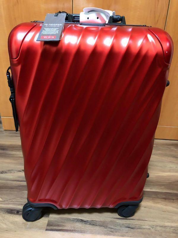 tumi red carry on