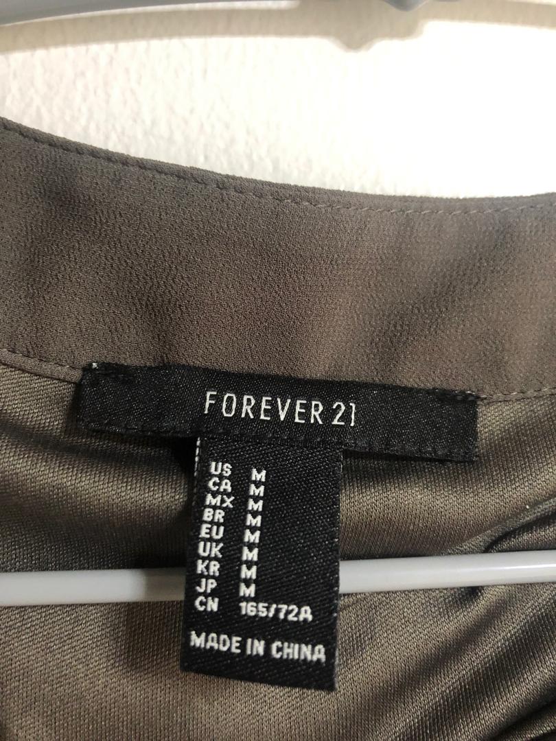Forever 21 grey overlap maxi skirt (Category: Skirts) located in Makati City. Submitted by vborja (Listing ID 231394594, Image 2). Description: Used once for an event Perfect for casual or dressy occassions.