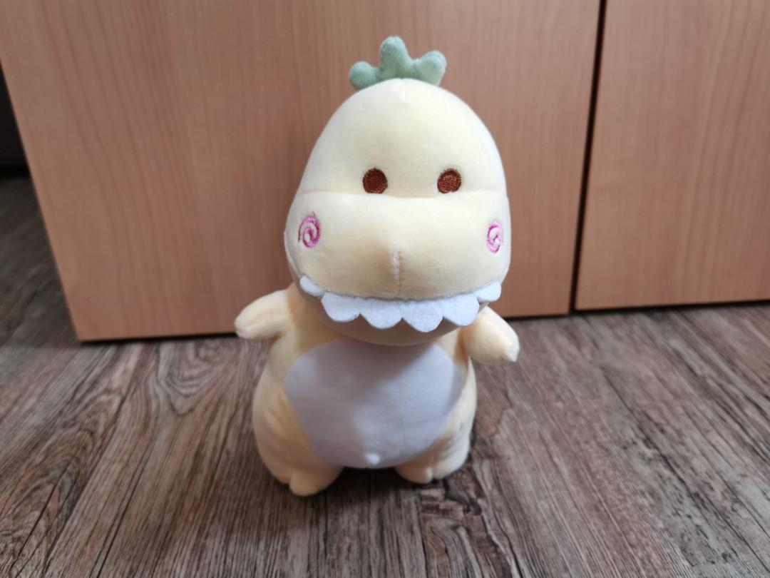 yellow stuffed dinosaur