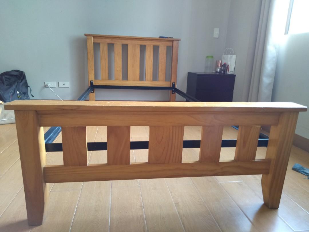 TWIN SIZED BED (Category: Bed Frames & Mattresses) located in Makati City. Submitted by joy.declutters (Listing ID 231190176, Image 3). Description: Twin sized strong wooden bed frame (headboard, footboard, slats) with metal side rails Slight scratches on headboard (will send pictures if needed)! Mattress used For pickup only, MAKATI area 5.5k with the matching wooden bedside table of the same color!.