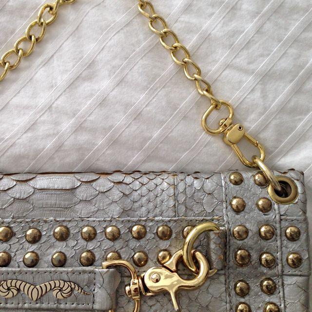 Disco Metallic Silver Python Clutch (Category: Bags & Wallets) located in Singapore. Submitted by ladyh82 (Listing ID 5666015, Image 3). Description: Made with genuine python skin. With soft calf leather lining and 18k gold plated Ares logo. Sling and clutch handbag for the real disco dancers! X.