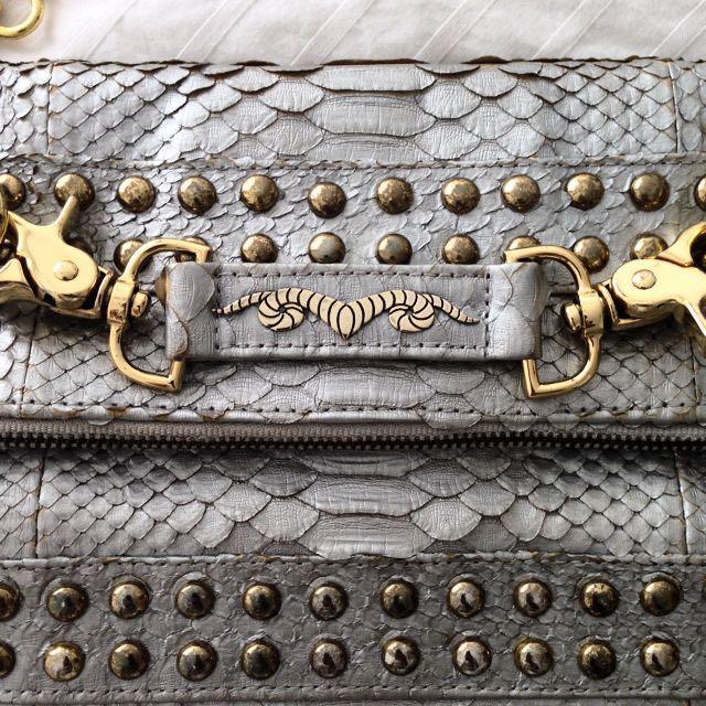Disco Metallic Silver Python Clutch (Category: Bags & Wallets) located in Singapore. Submitted by ladyh82 (Listing ID 5666015, Image 2). Description: Made with genuine python skin. With soft calf leather lining and 18k gold plated Ares logo. Sling and clutch handbag for the real disco dancers! X.