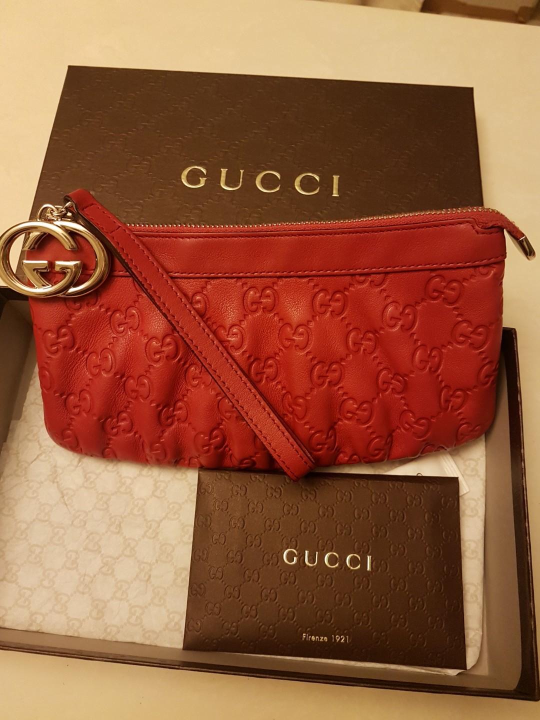 red gucci wristlet