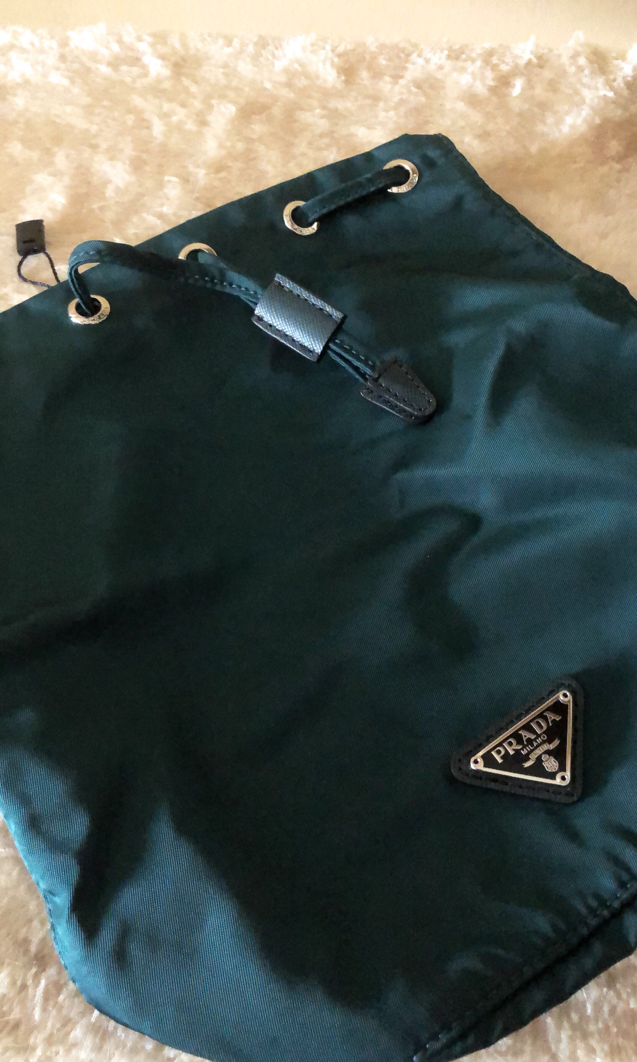 BNWT Prada Nylon Vela Necessaire Drawstring Pouch in Green, Luxury, Bags &  Wallets on Carousell