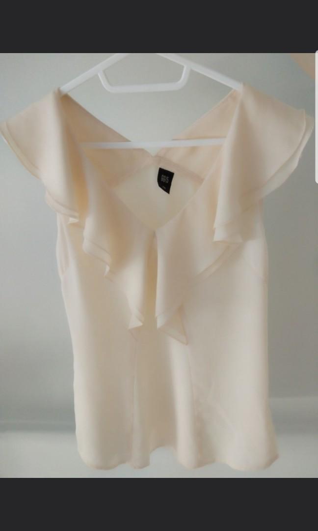 cream ruffle top