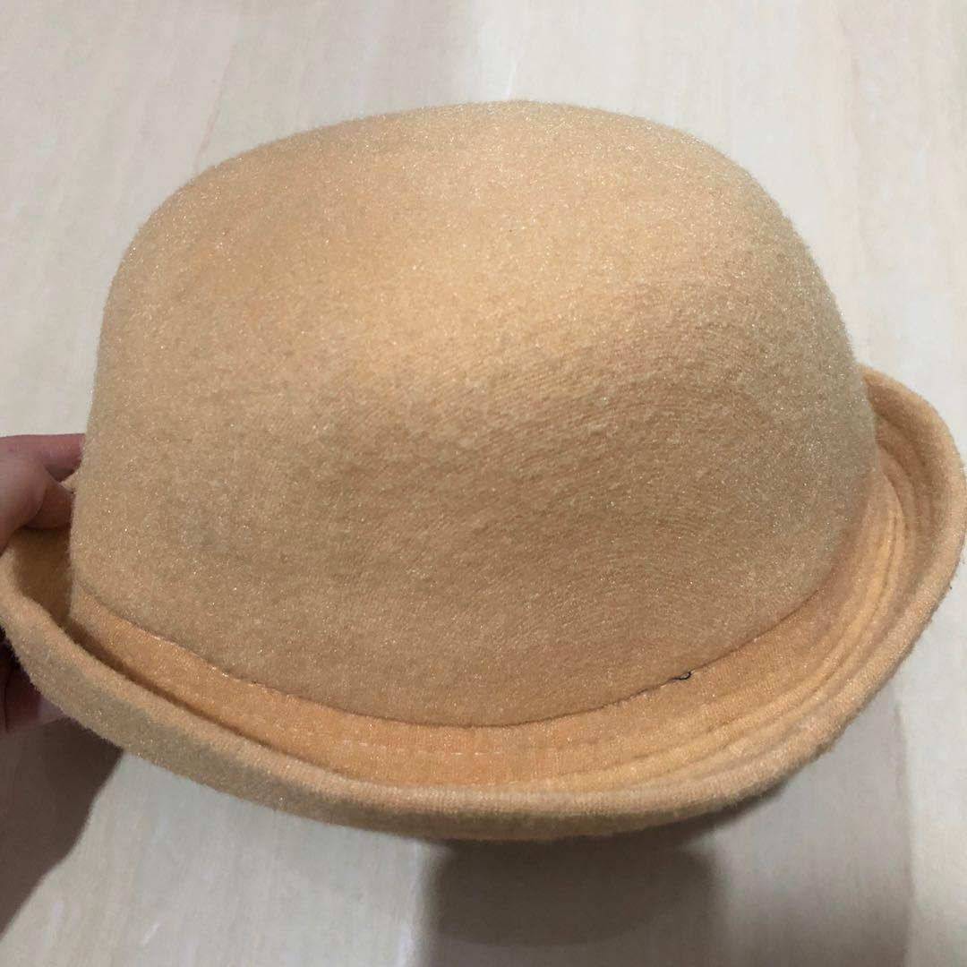 cream bowler hat