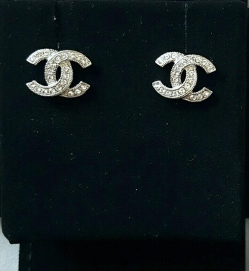 New authentic Chanel silver CC crystal earrings, Women's Fashion, Jewelry &  Organisers, Earrings on Carousell