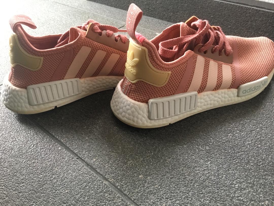 Adidas NMD (Category: Sneakers) located in Singapore. Submitted by alenore_ (Listing ID 232777039, Image 2). Description: Salmon Pink Adidas NMDs Only worn it once. Selling as shoe size is too small for me Size: US 6 (1/2) / UK 5 .