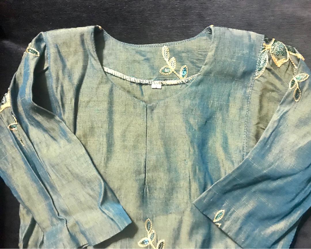 Preloved Dark Teal Baju Kurung (Category: Babies & Kids Fashion) located in Singapore. Submitted by littlemakciks (Listing ID 232694605, Image 3). Description: Preloved dark teal blueish baju kurung witb beautiful sequin flower design, suitable for 3-5yo dependable of body size. Pit to pit 33cm. Skirt waist 22cm stretchable up to 28cm with length 49cm.