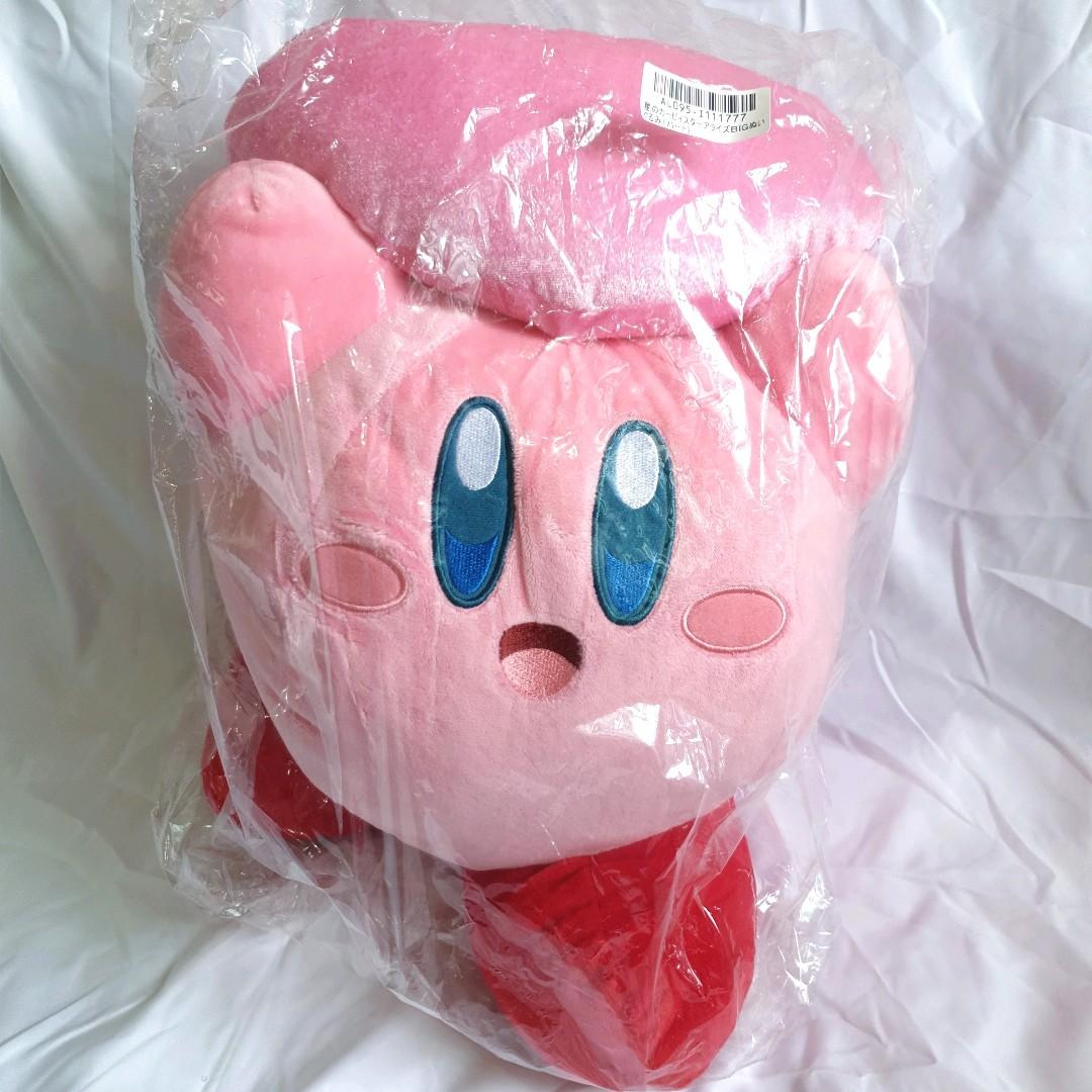 kirby holding heart plush