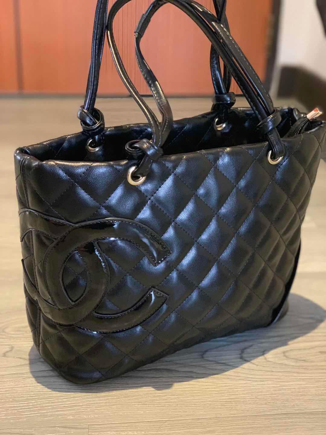 cross logo brand bag