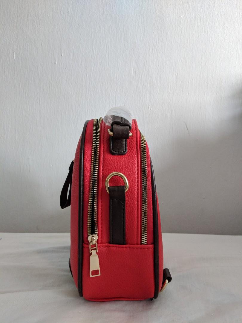 Chic Mini Backpack (Category: Shoulder Bags) located in Singapore. Submitted by woooodieee (Listing ID 233811605, Image 2). Description: Brand new mini backpack. Comes with keychain and detachable straps. Perfect for a chill day out. Received as a gift but selling cuz red isn't my colour. Meet-ups at Tampines, open to compromise if schedule permits!.