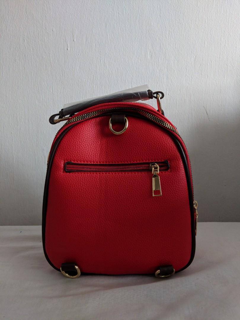 Chic Mini Backpack (Category: Shoulder Bags) located in Singapore. Submitted by woooodieee (Listing ID 233811605, Image 3). Description: Brand new mini backpack. Comes with keychain and detachable straps. Perfect for a chill day out. Received as a gift but selling cuz red isn't my colour. Meet-ups at Tampines, open to compromise if schedule permits!.