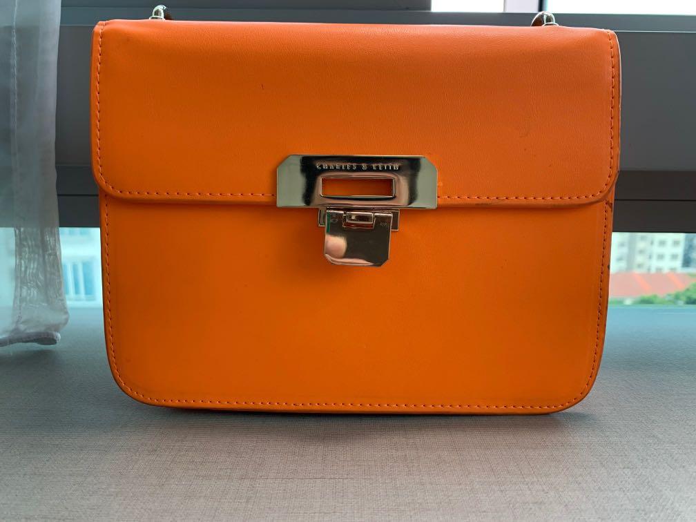 charles and keith orange sling bolsa