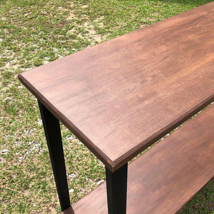 Solid wood console table (Category: Tables & Sets) located in Kuala Lumpur. Submitted by fureka.co (Listing ID 234392357, Image 1). Description: Solid wood console table stained with mahogany colored stain. - solid wood top and bottom - steel structure supported leg - rubber shoes leg - black matte steel spray painted Size : L150cm x W30cm x H76cm Whatsapp us for more. Visit our instagram at fureka.co.