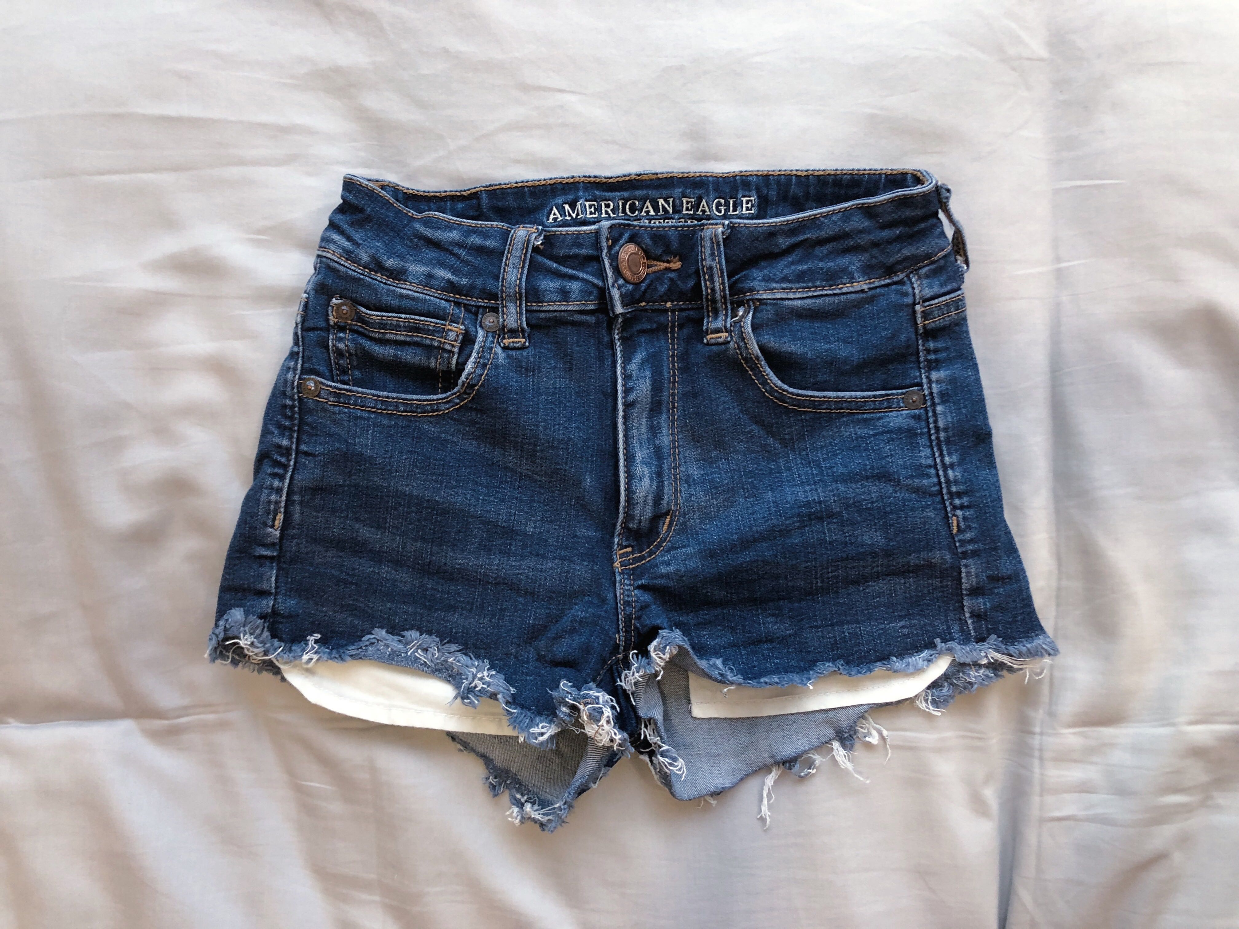 exposed pocket denim shorts
