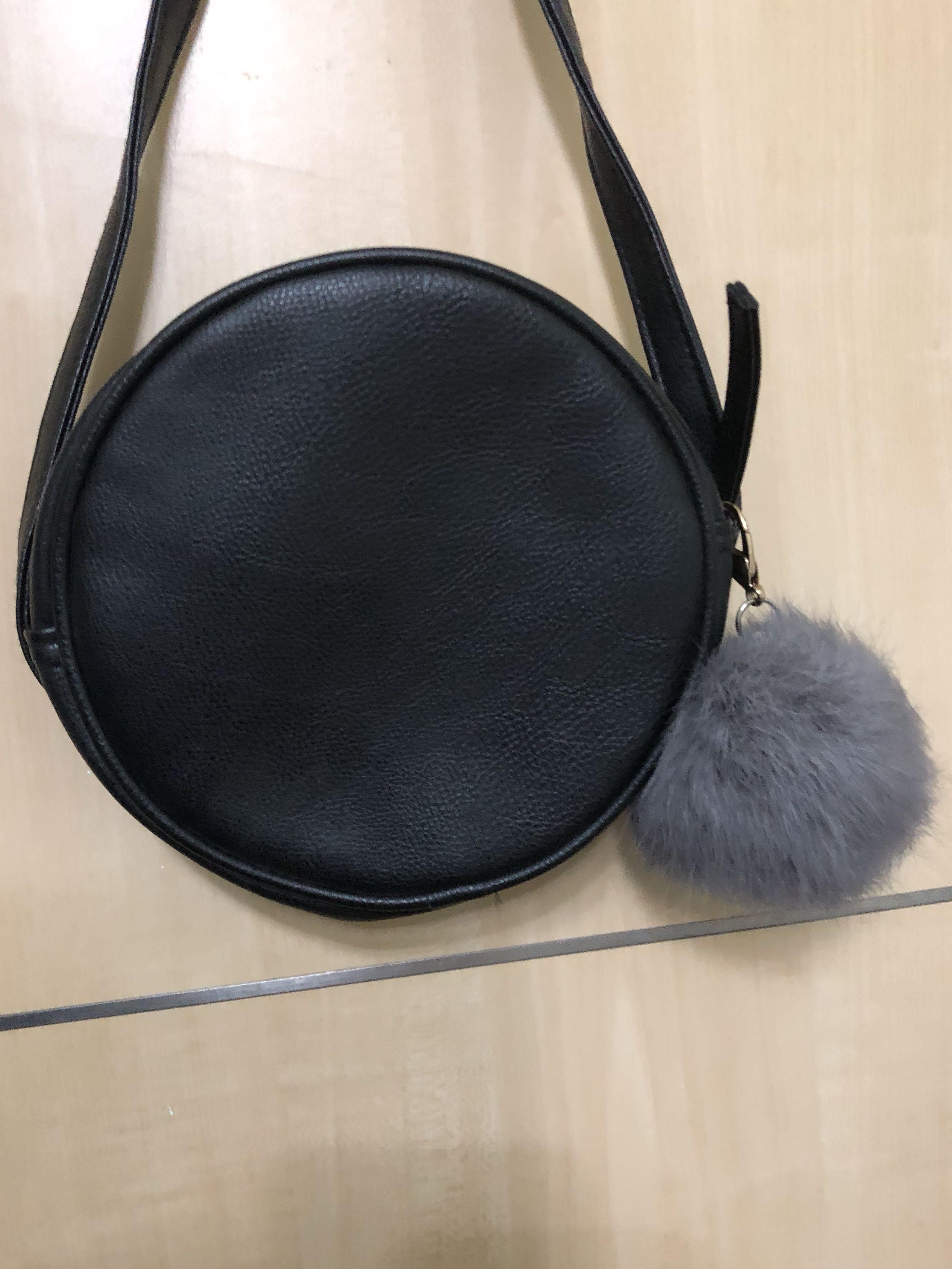 Black round sling bag clearance