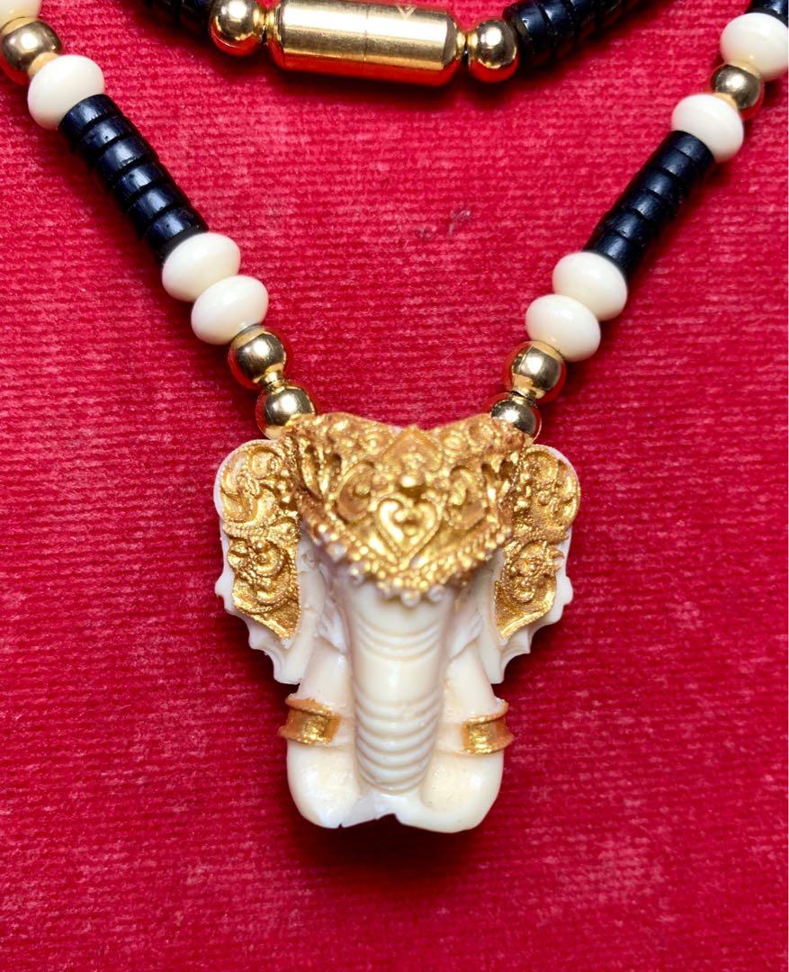 Gold elephant discount head necklace