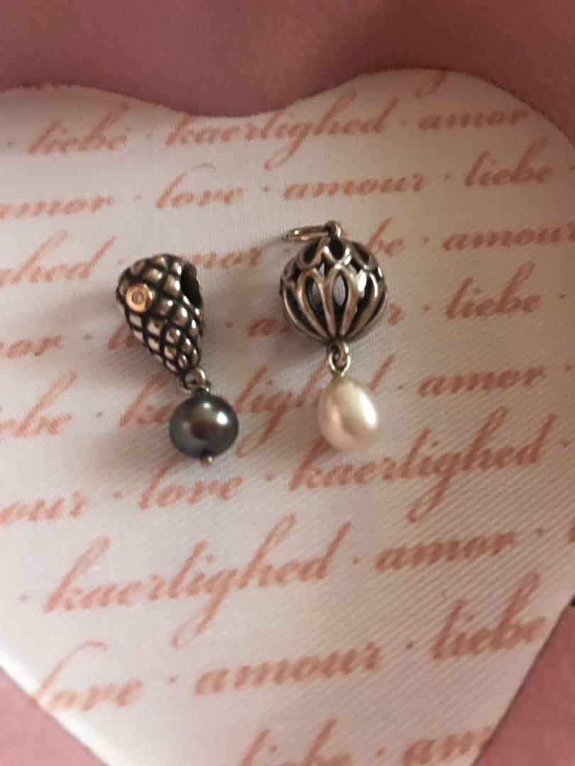 PANDORA Retired and HTF Charms (Category: Charms) located in Kalibo. Submitted by jayteeptrp (Listing ID 234523077, Image 2). Description: Pandora Grapebunch diamond TT grey pearl Charm Price: ₱3,500 Pandora Pearl Drop Pendant Price: ₱2,500 These are original and retired Pandora charms. Both items were bought in the UK. Both are in excellent condition. No inclusion but will be properly packed upon shipping. MOP: BPI deposit.