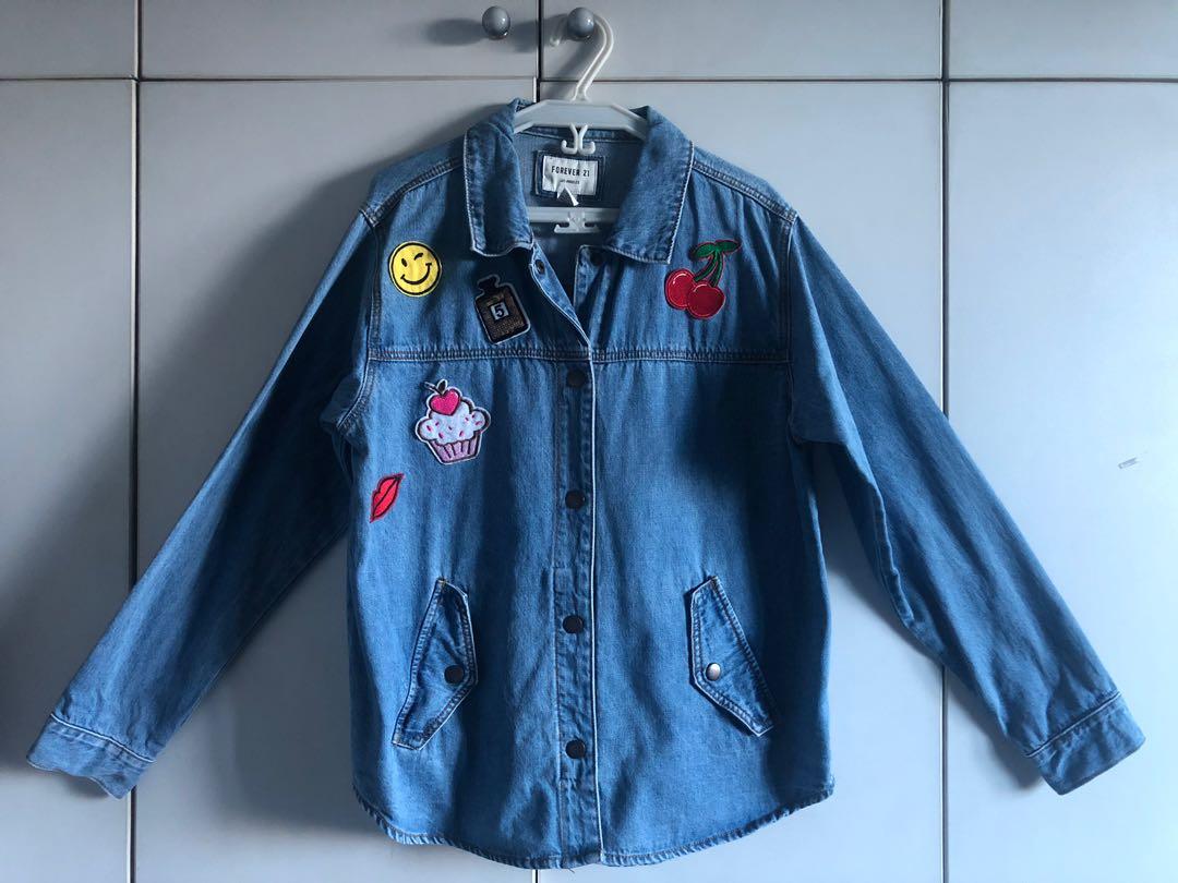 F21 Denim Jacket (Category: Coats, Jackets and Outerwear) located in Quezon City. Submitted by basille (Listing ID 234699011, Image 1). Description: Patches are personalized (not originally bought with the jacket itself) Loose fitting.