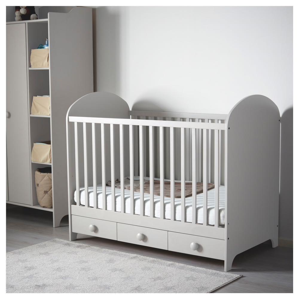 grey cot with drawers