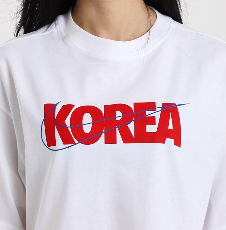 white shirt with red logo