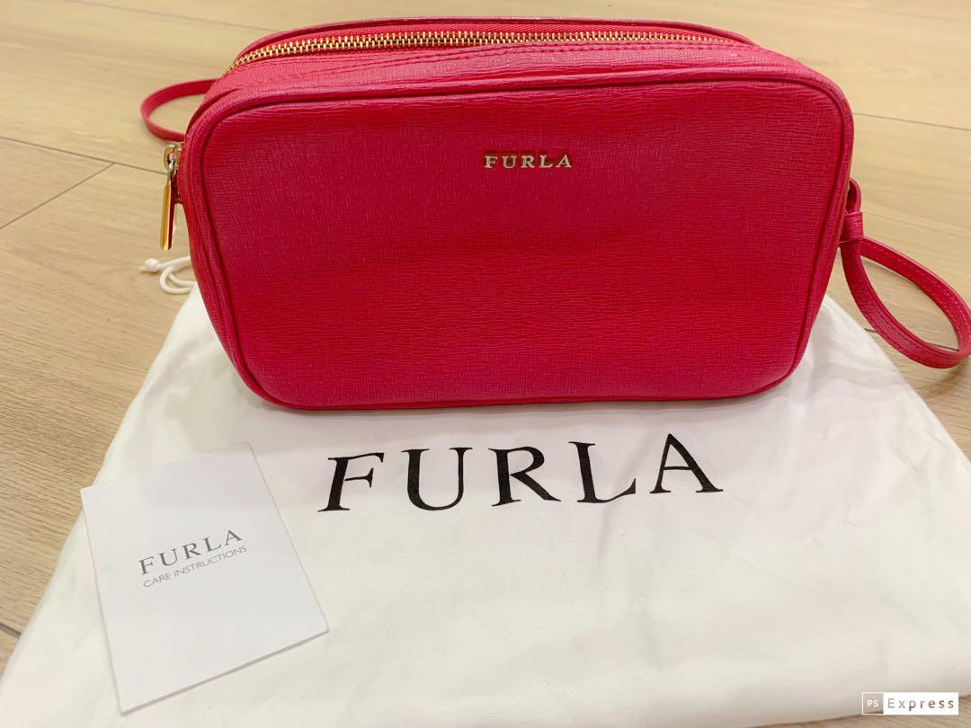 Furla double zipped camera bag (Category: Luxury Bags & Wallets) located in Quezon City. Submitted by starg888 (Listing ID 235878859, Image 1). Description: Furla double zipped camera bag With care card and dustbag .