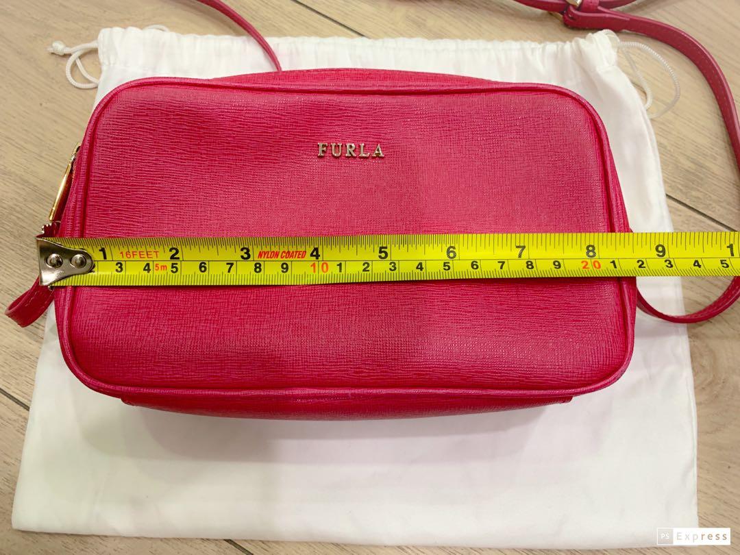Furla double zipped camera bag (Category: Luxury Bags & Wallets) located in Quezon City. Submitted by starg888 (Listing ID 235878859, Image 3). Description: Furla double zipped camera bag With care card and dustbag .