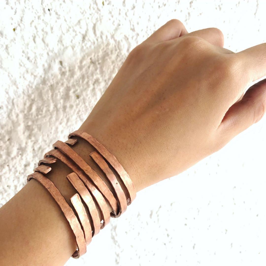 Handmade Pure Copper Bangle (Category: Bracelets) located in Quezon City. Submitted by therapii.manila (Listing ID 235888571, Image 1). Description: This handmade hammered pure copper bangle is adjustable so you can choose to wear it tightly or loosely. The bangle is cold hammered to reach flattened surface and maintain its strength. We also added a fine texture for beautiful light reflection and style. The extremes of the bangle were thoroughly 