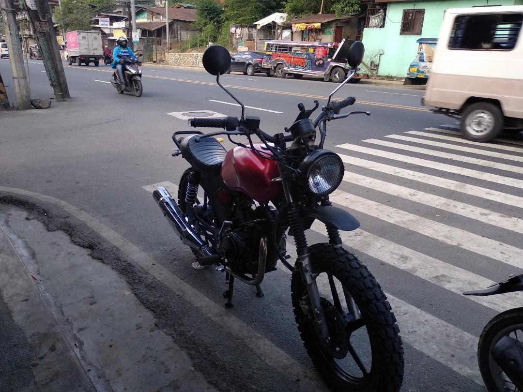Scrambler motorcycle cafe racer (Category: Motorbikes) located in Pasig City. Submitted by judah17francisco (Listing ID 236169437, Image 3). Description: Selling my scrambler motorcycle.base bike is a Yamaha ybr-125g.tank painted candy red. Has already been proven on long rides.has a lot of torque despite only being 125cc.really dependable bike.change oil every month.no problems whatsoever with engine..
