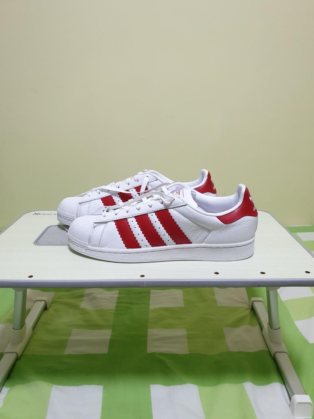 White adidas with new arrivals red stripes