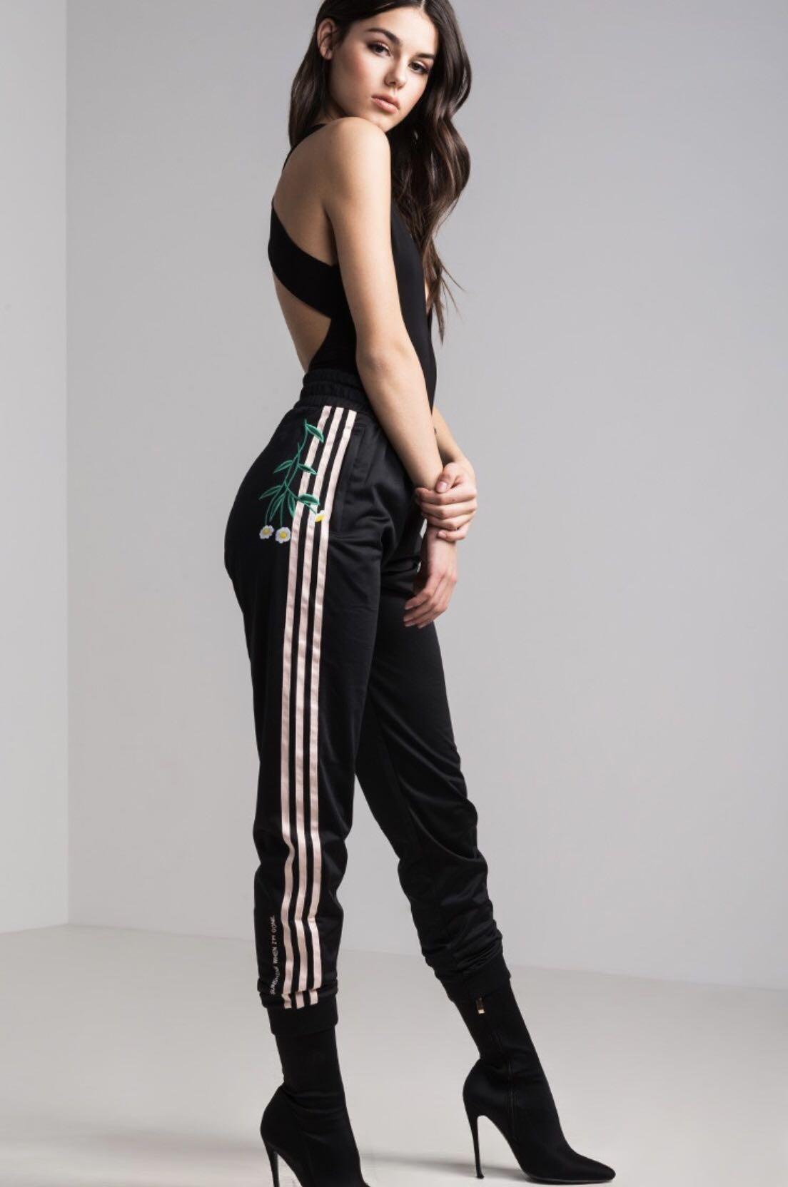 black adidas pants with pink stripes