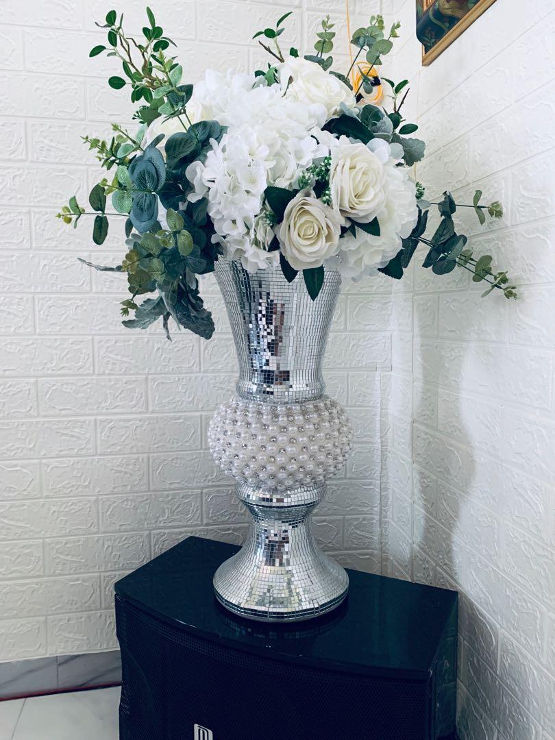 Chrome vase with white flower exclusive with arrangement done