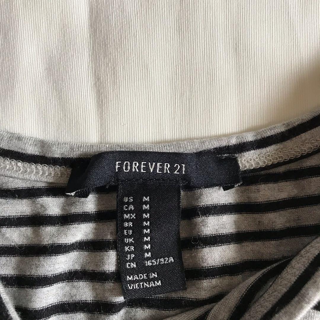 Forever 21 striped sleeveless crop top (Category: Sleeveless) located in Manila. Submitted by boldcloset (Listing ID 236944274, Image 2). Description: Forever 21 Striped sleeveless crop top - gray and black stripes - fits s/m - payment via bdo(deposit).